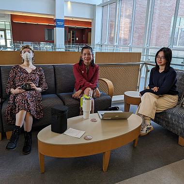 Trang Tran, Moon Sum, and Ray Broad wait for students to take their professional headshots.